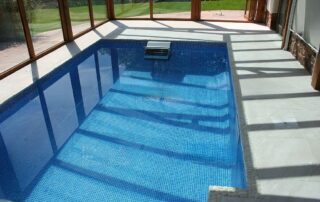 This image shows a pool with a newly resurfaced deck.