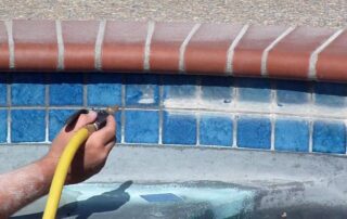 This image shows a pool tile being repaired.