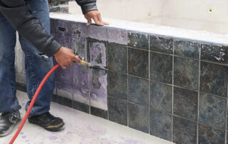 This image shows a pool tile being repaired.