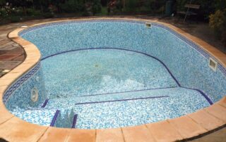 This image shows a pool tiles being cleaned.